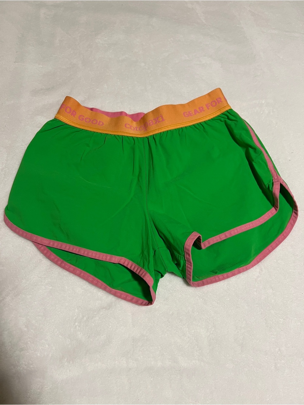 cotopaxi Green Athletic Shorts with Pink Trim and Yellow Waistband